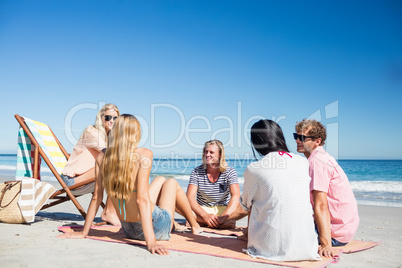 Friends lying on the beach