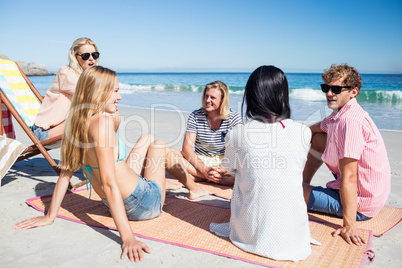 Friends lying on the beach