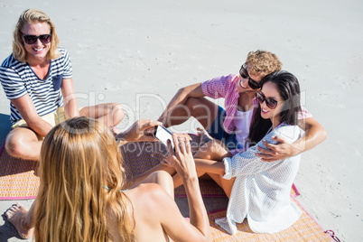 Friends lying on the beach