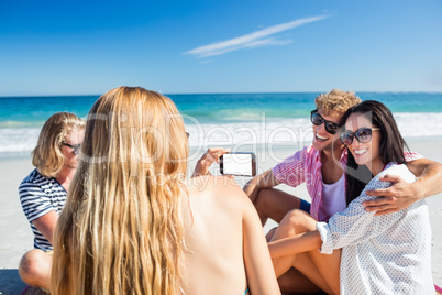 Friends lying on the beach