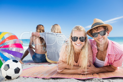 Friends lying on the beach