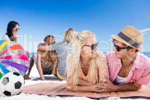 Friends lying on the beach