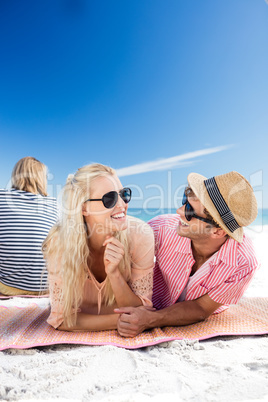 Friends lying on the beach