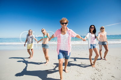 Portrait of friends posing at the beach