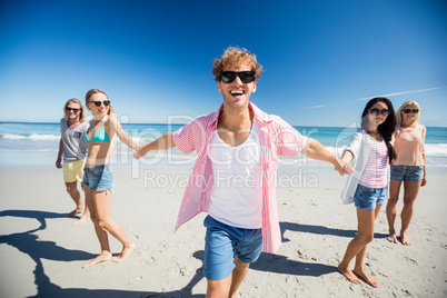 Portrait of friends posing at the beach