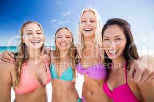 Portrait of friends posing at the beach