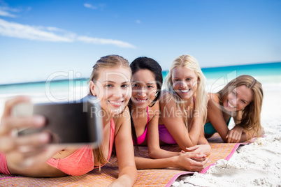 Portrait of friends posing at the beach