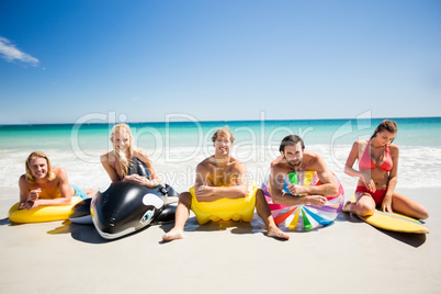 Friends lying on buoy