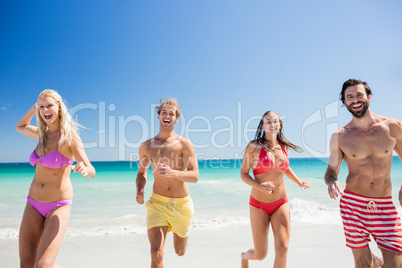 Portrait of friends posing at the beach