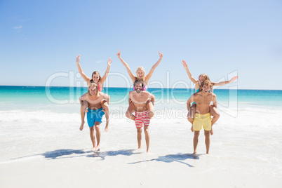 Portrait of friends posing at the beach