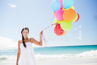 Beautiful woman holding balloon