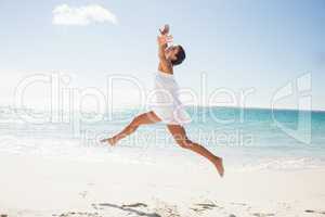 Happy woman relaxing at the beach