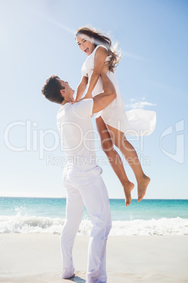 Portrait of handsome man holding his girlfriend Portrait of handsome man holding his girlfriend