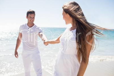 A woman holding the hand of her boyfriend