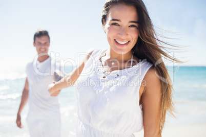 A woman holding the hand of her boyfriend