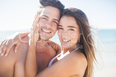 Front view of cute couple embracing