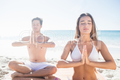 Happy couple doing yoga