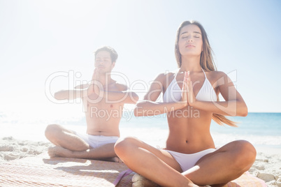 Happy couple doing yoga