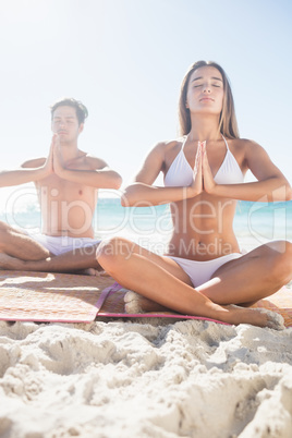 Happy couple doing yoga
