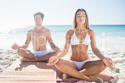 Happy couple doing yoga