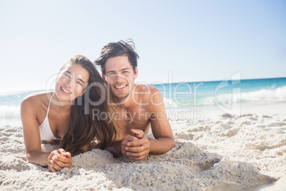 Cute couple lying and smiling