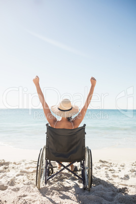 Wheelchair woman sitting  with arms up