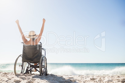 Wheelchair woman sitting  with arms up
