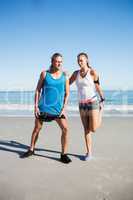 Couple stretching at the beach