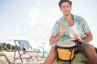 Passionate man playing drums