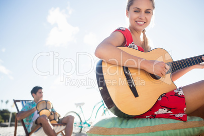 Woman playing the guitar