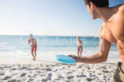 Friends playing with a frisbee