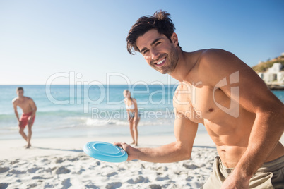 Friends playing with a frisbee