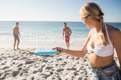 Friends playing with a frisbee