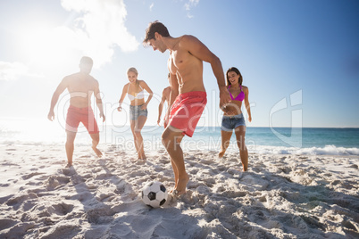 Friends playing football