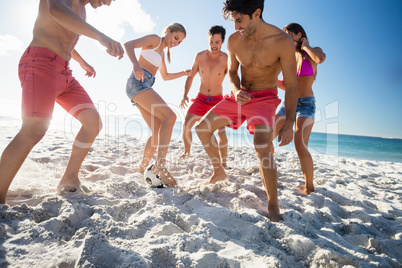 Friends playing football