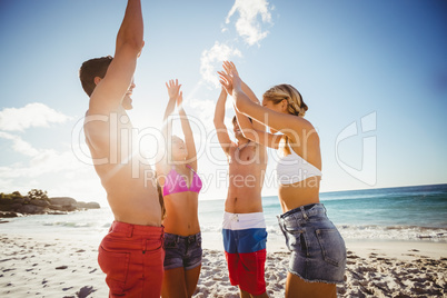 Friends dancing at the beach