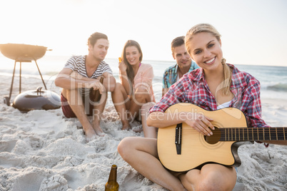Friends playing the guitar
