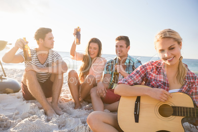 Friends playing the guitar