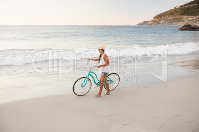Woman walking her bike