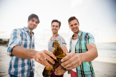 Friends cheering with beer