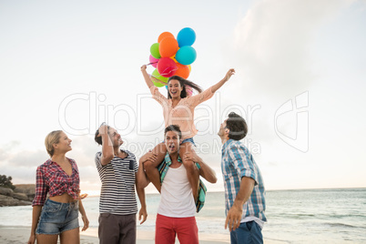 Friends holding balloons