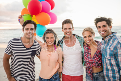 Friends holding balloons