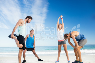 People stretching on the beach