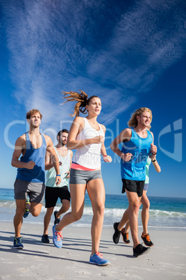 People jogging on the beach