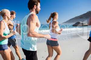 People jogging on the beach