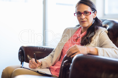 Woman psychologist sitting down
