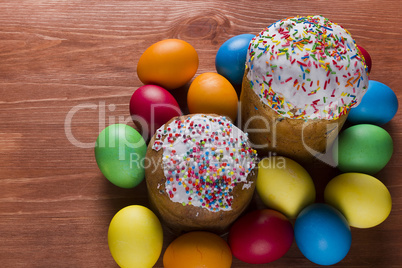 Easter eggs of different colors and cakes