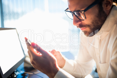 Businessman working and looking his phone