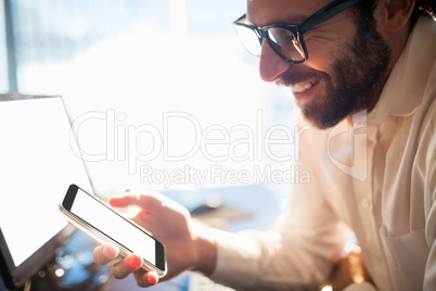 Businessman working and looking his phone