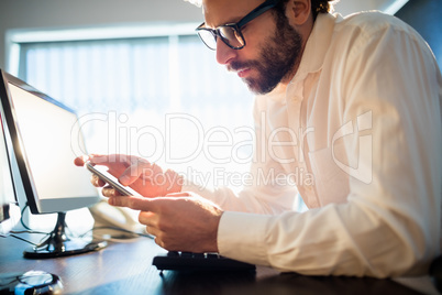 Businessman working and looking his phone